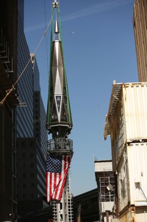 NEW YORK, NY - MAY 02: The 408-foot spire is hoisted onto a temporary platform on the top of One World Trade Center on May 2, 2013 in New York City. When bolted into place at a later date, the spire will make One World Trade Center the tallest building in the Western Hemisphere.The raising of the spire, which comes on the second anniversary of the death of Osama bin Laden, will make One World Trade Center 1,776 feet tall. One World Trade Center is built on the site where the September 11, 2001 attacks toppled the original World Trade Center towers. (Photo by Spencer Platt/Getty Images)