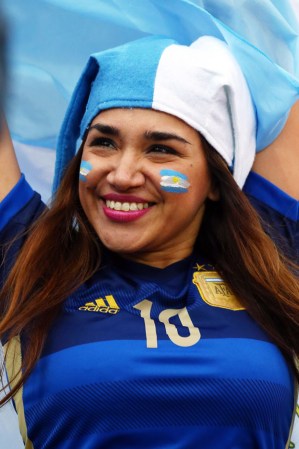 SAO PAULO, BRAZIL - JULY 09: An Argentina fan enjoys the atmosphere prior to the 2014 FIFA World Cup Brazil Semi Final match between the Netherlands and Argentina at Arena de Sao Paulo on July 9, 2014 in Sao Paulo, Brazil. (Photo by Ronald Martinez/Getty Images)
