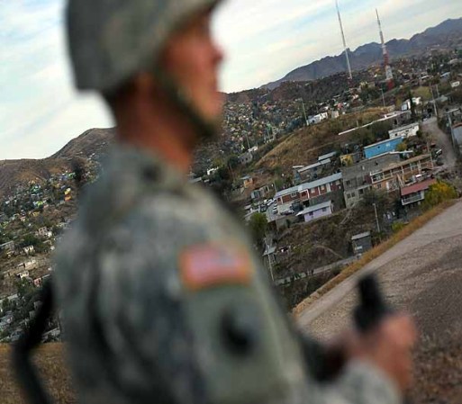 NOGALES, AZ - DECEMBER 07: Arizona National Guardsmen watch over the U.S. border with Mexico at an observation post on December 7, 2010 in Nogales, Arizona. The Obama administration ordered more than 500 soldiers placed along the Arizona border to man "entry identification sites" and spot illegal immigrants crossing into the United States. The troops, who have no detention authority, radio U.S. Border Patrol agents when they spot immigrants crossing. The troop deployment was meant to further bolster border security and help stem illegal immigration into Arizona, which has become a flashpoint for the issue nationwide. (Photo by John Moore/Getty Images)