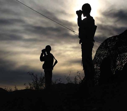 NOGALES, AZ - DECEMBER 07: Arizona National Guardsmen watch over the U.S. border with Mexico at an observation post on December 7, 2010 in Nogales, Arizona. The Obama administration ordered more than 500 soldiers placed along the Arizona border to man "entry identification sites" and spot illegal immigrants crossing into the United States. The troops, who have no detention authority, radio U.S. Border Patrol agents when they spot immigrants crossing. The troop deployment was meant to further bolster border security and help stem illegal immigration into Arizona, which has become a flashpoint for the issue nationwide. (Photo by John Moore/Getty Images)