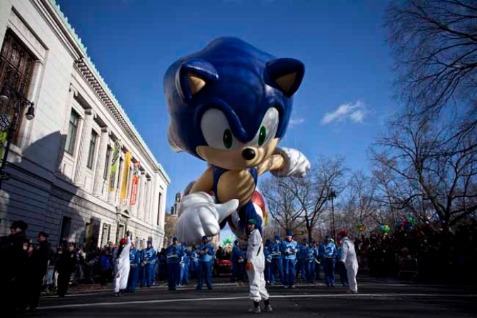 NEW YORK, NY - NOVEMBER 28: The Sonic the Hedgehog balloon floats above the street during the Macy's Thanksgiving Day Parade on November 28, 2013 in New York City. Despite earlier concerns about the wind, the balloons flew as planned for the parade. (Photo by Kena Betancur/Getty Images)