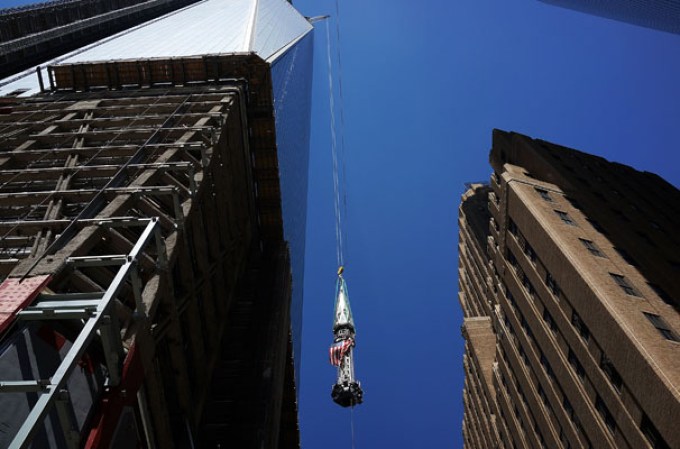 NEW YORK, NY - MAY 02: The 408-foot spire is viewed as it is hoisted onto a temporary platform on the top of One World Trade Center on May 2, 2013 in New York City. When bolted into place at a later date, the spire will make One World Trade Center the tallest building in the Western Hemisphere.The raising of the spire, which comes on the second anniversary of the death of Osama bin Laden, will make One World Trade Center 1,776 feet tall. One World Trade Center is built on the site where the September 11, 2001 attacks toppled the original World Trade Center towers. (Photo by Spencer Platt/Getty Images)