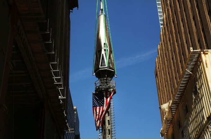 NEW YORK, NY - MAY 02: The 408-foot spire is hoisted up onto a temporary platform on the top of One World Trade Center on May 2, 2013 in New York City. When bolted into place at a later date, the spire will make One World Trade Center the tallest building in the Western Hemisphere.The raising of the spire, which comes on the second anniversary of the death of Osama bin Laden, will make One World Trade Center 1,776 feet tall. One World Trade Center is built on the site where the September 11, 2001 attacks toppled the original World Trade Center towers. (Photo by Spencer Platt/Getty Images)