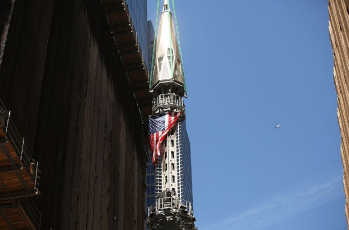 NEW YORK, NY - MAY 02: The 408-foot spire is hoisted onto a temporary platform on the top of One World Trade Center on May 2, 2013 in New York City. When bolted into place at a later date, the spire will make One World Trade Center the tallest building in the Western Hemisphere.The raising of the spire, which comes on the second anniversary of the death of Osama bin Laden, will make One World Trade Center 1,776 feet tall. One World Trade Center is built on the site where the September 11, 2001 attacks toppled the original World Trade Center towers. (Photo by Spencer Platt/Getty Images)