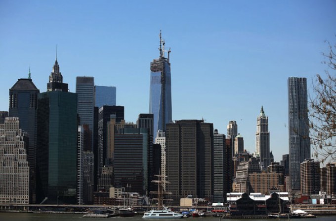NEW YORK, NY - MAY 02: The 408-foot spire can be seen from the Brooklyn Promenade after it was hoisted onto a temporary platform on the top of One World Trade Center on May 2, 2013 in New York City. When bolted into place at a later date, the spire will make One World Trade Center the tallest building in the Western Hemisphere.The raising of the spire, which comes on the second anniversary of the death of Osama bin Laden, will make One World Trade Center 1,776 feet tall. One World Trade Center is built on the site where the September 11, 2001 attacks toppled the original World Trade Center towers. (Photo by Spencer Platt/Getty Images)
