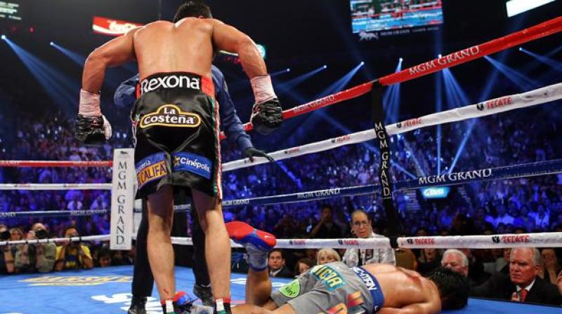 LAS VEGAS, NV - DECEMBER 08: Manny Pacquiao lays face down on the mat after being knocked out in the sixth round by Juan Manuel Marquez during their welterweight bout at the MGM Grand Garden Arena on December 8, 2012 in Las Vegas, Nevada. (Photo by Al Bello/Getty Images)