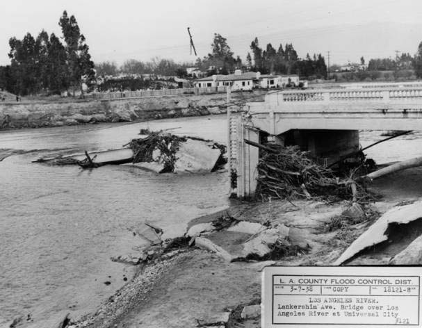 This 1938 image was taken at the confluence of the LA River and the Central Branch of the Tujunga Wash. The flood washed away the Lankershim Blvd Bridge by Universal City. This photo was taken on the south side of the river looking toward the northeast.
