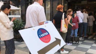 Voters near the entrance of the Ace Hotel in Downtown Los Angeles to cast their vote for the 2020 California primaries on Tuesday.