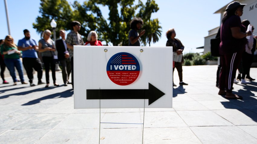 Voters line up to cast ballots at a polling station in Los Angeles, California, the United States, March 3, 2020.