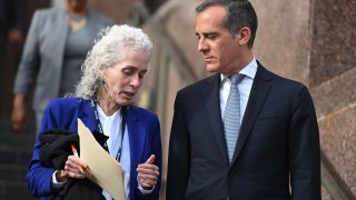 Los Angeles County Public Health director Barbara Ferrer (L) and Los Angeles Mayor Eric Garcetti speak as they arrive for a press conference on March 4, 2020, in Los Angeles.