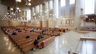 Worshippers attend Sunday Mass at the Cathedral of Our Lady of the Angel in Los Angeles, Calif.