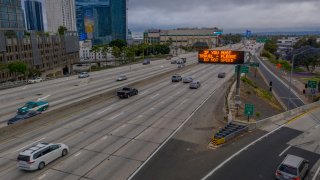 Traffic moves on a freeway near downtown Los Angeles.