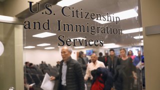Immigrants prepare to become American citizens and are waiting in line