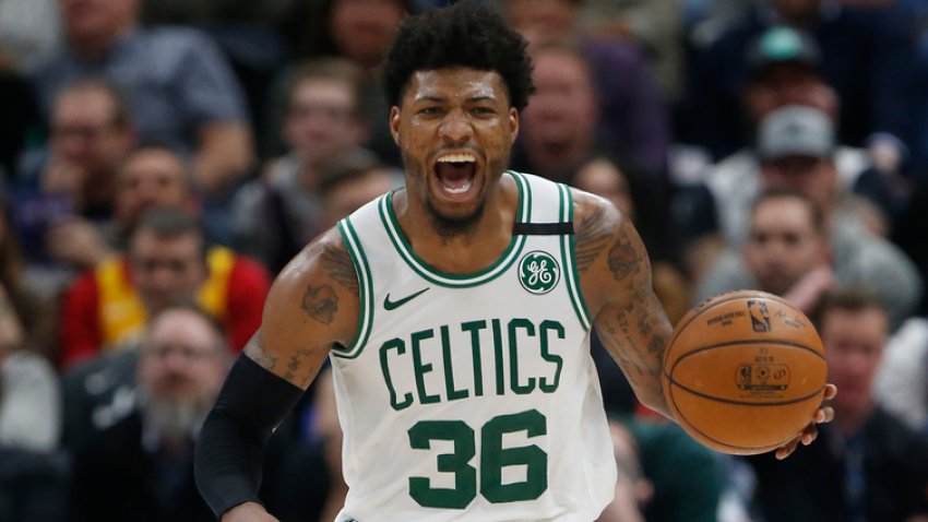 Boston Celtics guard Marcus Smart brings the ball up during the second half of the team’s NBA basketball game against the Utah Jazz on Wednesday, Feb. 26, 2020, in Salt Lake City. (AP Photo/Rick Bowmer)