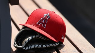 A baseball glove and Angels cap.