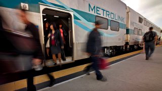 Incoming Metrolink passengers deboard the train at Union Station.