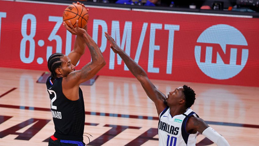 Kawhi Leonard #2 of the LA Clippers shoots against Dorian Finney-Smith #10 of the Dallas Mavericks during the second quarter in Game Six of the Western Conference First Round during the 2020 NBA Playoffs at AdventHealth Arena at ESPN Wide World Of Sports Complex on Aug. 30, 2020 in Lake Buena Vista, Florida.