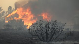 A house burns during the Bobcat Fire on September 18, 2020 in Juniper Hills, California