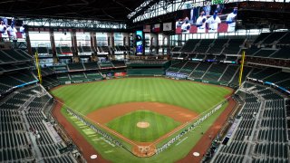 In this July 24, 2020, file photo, a general view of the inaugural game at Globe Life Field as players line the base paths for the pre-game ceremony before the game between the Colorado Rockies and the Texas Rangers at Globe Life Field in Arlington in Arlington, Texas.