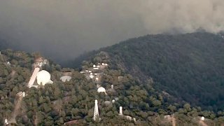 Smoke rises near Mount Wilson Observatory.