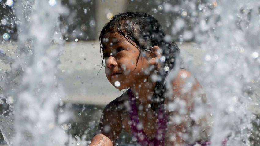 LOS ANGELES, CA – JUNE 28:  Emely Martinez, 5, cools off in the Arthur J. Will Memorial Fountain inside Grand Park during a major heat wave in Southern California on June 28, 2013 in downtown Los Angeles, California. Temperatures are expected to be in the triple digits in most areas of Southern California. According to the national Weather Service, the heat wave is expected to linger into early next week prompting heat advisories and opening of cooling centers.  (Photo by Kevork Djansezian/Getty Images)