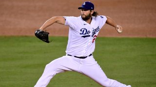 Clayton Kershaw #22 of the Los Angeles Dodgers pitches against the Milwaukee Brewers during the third inning in game two of the National League Wild Card Series at Dodger Stadium on Oct. 1, 2020 in Los Angeles, California.