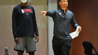 Tyronn Lue of the LA Clippers coaches during practice.