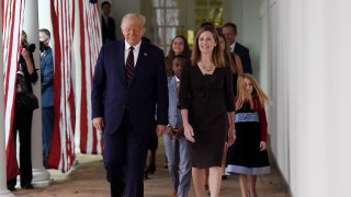 President Donald Trump and Judge Amy Coney Barrett walk to the Rose Garden of the White House, Sept. 26, 2020. Trump nominated Barrett to the US Supreme Court, after Supreme Court Justice Ruth Bader Ginsburg died at 87. The nomination sparked a tug-of-war between the Republicans and Democrats, the latter of which said the open seat should be filled by the next president this close to the election.