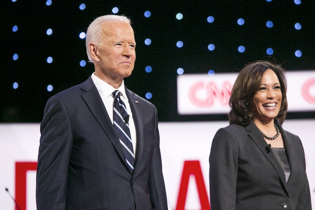 Joe Biden and Kalama Harris stand on stage.