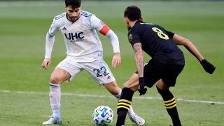 COLUMBUS, OHIO - DECEMBER 06: Carles Gil #22 of New England Revolution controls the ball against Artur #8 of Columbus Crew during the Eastern Conference Final of the MLS Cup Playoffs at MAPFRE Stadium on December 06, 2020 in Columbus, Ohio. Columbus Crew won 1-0.