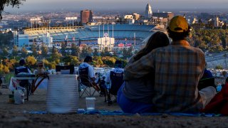 Fans watching Dodger game from afar at Elysian Park in Los Angeles, CA.