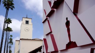 An Oscar statue design on a red carpet backdrop is pictured at Union Station, one of the locations for Sunday's 93rd Academy Awards on April 24, 2021 in Los Angeles, California.