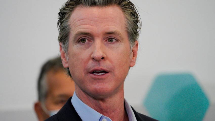 Governor Gavin Newsom speaks with news reporters at Park de la Cruz Recreation Center on Friday, April 2, 2021 in San Diego about the San Diego’s newest pop-up vaccination site in the City Heights neighborhood. (Nelvin C. Cepeda/The San Diego Union-Tribune via AP)