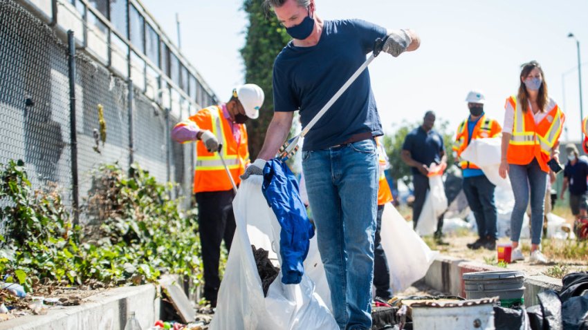 LOS ANGELES, CA – MAY 11: Gov. Gavin Newsom helps clean a Caltrans property in Los Angeles where he announced $1.5 billion for cleaning up California on Tuesday, May 11, 2021. (Photo by Sarah Reingewirtz/MediaNews Group/Los Angeles Daily News via Getty Images)”n