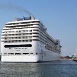 The the 92,409-ton, 16-deck MSC Orchestra cruise ship exits the lagoon as it leaves Venice, Italy