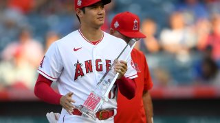 Shohei Ohtani #17 of the Los Angeles Angels was presented with his MVP of the month award before the Seattle Mariners at Angel Stadium of Anaheim on July 16, 2021 in Anaheim, California.