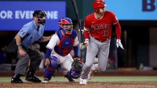 Shohei Ohtani #17 of the Los Angeles Angels runs to first base on a ground out ball against the Texas Rangers in the top of the seventh inning at Globe Life Field on September 29, 2021 in Arlington, Texas.