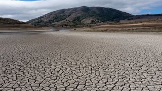 A cracked lake bed at Nicasio Reservoir during a drought in Nicasio, California, U.S., on Wednesday, Oct. 13, 2021. Residents failed to significantly cut back their water consumption in July, California state officials announced, foreshadowing some difficult decisions for Governor Newsoms administration as an historic drought lingers into the fall. Photographer: David Paul Morris/Bloomberg via Getty Images