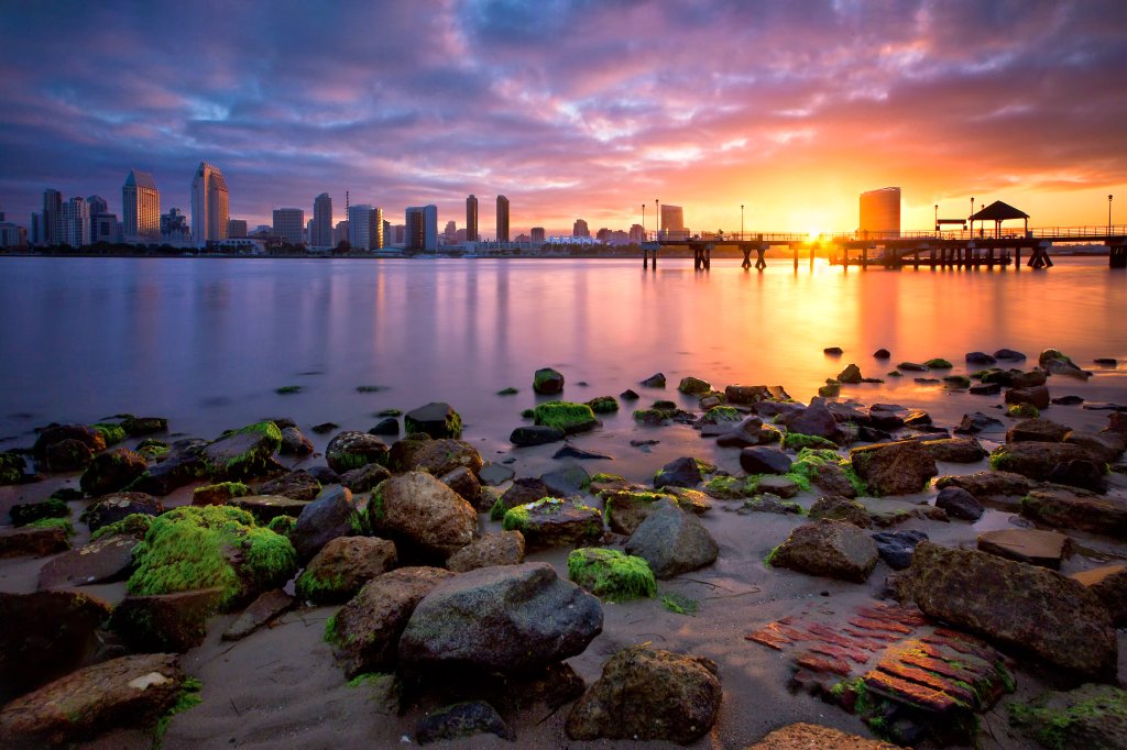 A surreal sunrise of downtown San Diego skyline taken from Coronado