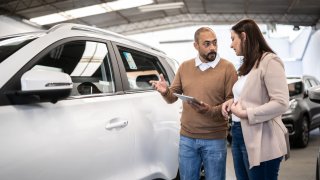 A woman shops for SUVs in this file photo.