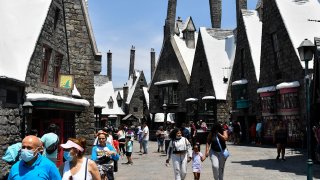Guests walk through The Wizarding World of Harry Potter.