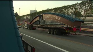 An arch arrives early Friday April 1, 2022 for installation in LA's Filipinotown.
