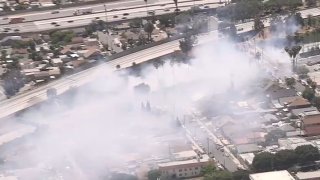 Small brush fires burn near the 60 Freeway.