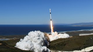 A SpaceX Falcon 9 rocket lifts off.