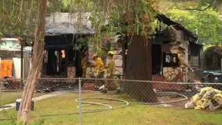 Firefighters at the scene of a house fire in Eagle Rock Friday Dec. 2, 2022.