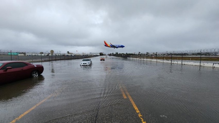 Some cars were getting stuck on a flooded street in North Hollywood not far from Burbank Airport as a powerful storm swept over Southern California Friday.