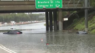 Cars are stranded in water on the 5 Freeway in Sun Valley Saturday Feb. 25, 2023.