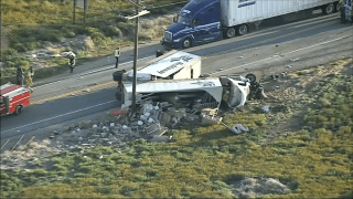 A big rig overturned on the side of Highway 138.