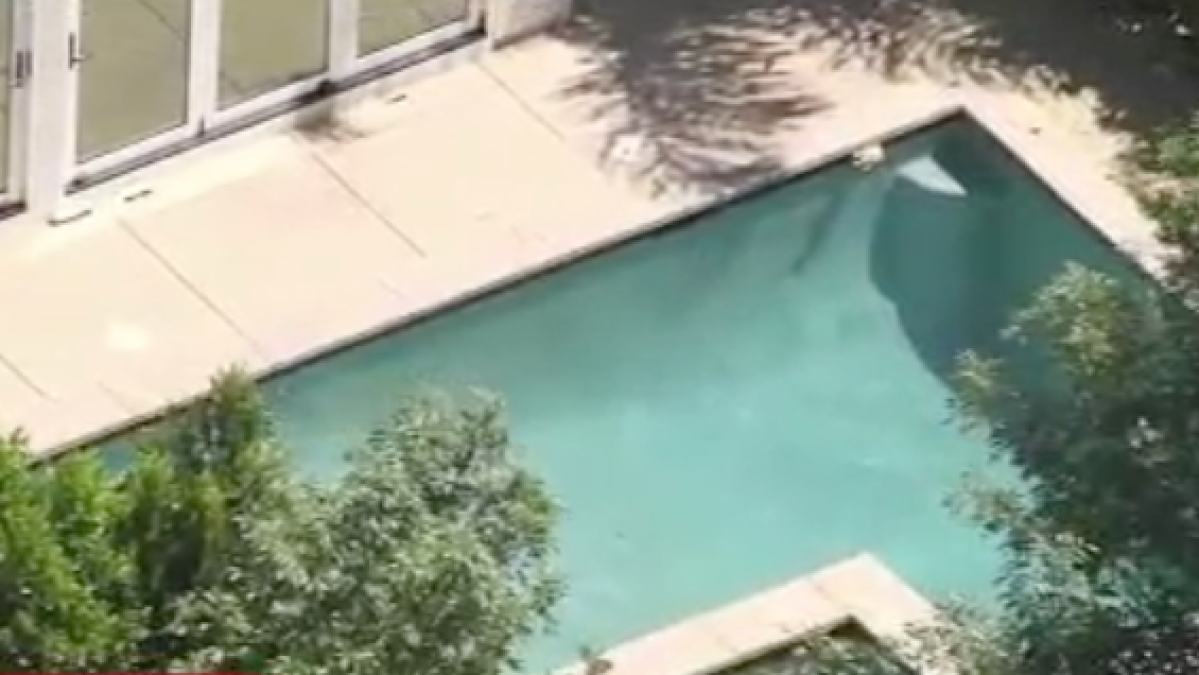 Unconscious twins found in Porter Ranch pool, one dead, the other fighting for his life