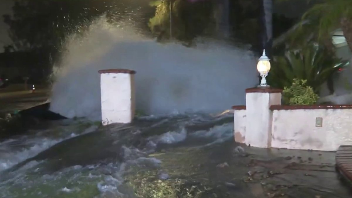 Water main break damages home and floods streets in Northridge